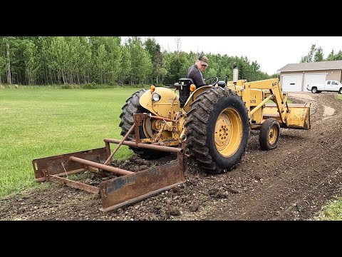Tractor land plane with lawn edger