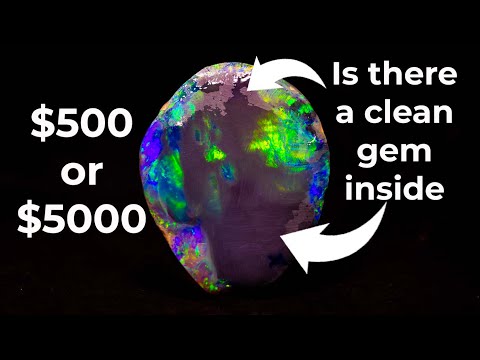 This gem black opal was covered in inclusions. I get them out for a profit