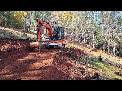 Steep hillside road repair and building with the Kubota KX 040 4