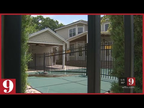 Video: Property owner builds fence through pool | WFTV