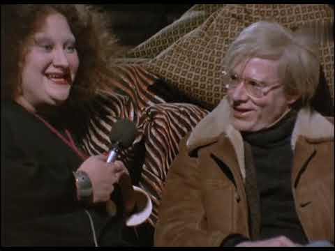 Pat Ast Serenading Andy Warhol at Halston's Atelier (1972)