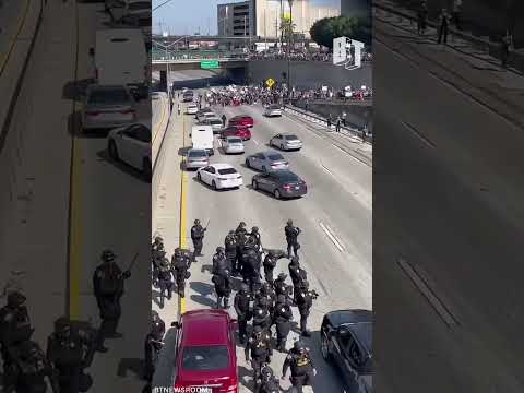 Police fired rubber bullets and flashbangs after pro-immigrant protesters halt Los Angeles traffic.