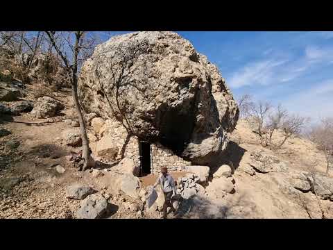 Building an amazing, cozy and warm shelter with a fireplace and chimney under a huge ancient stone