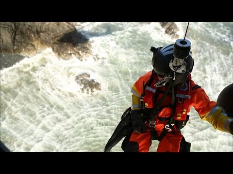 Coast Guard: Cape Disappointment: Surfer on the Rocks