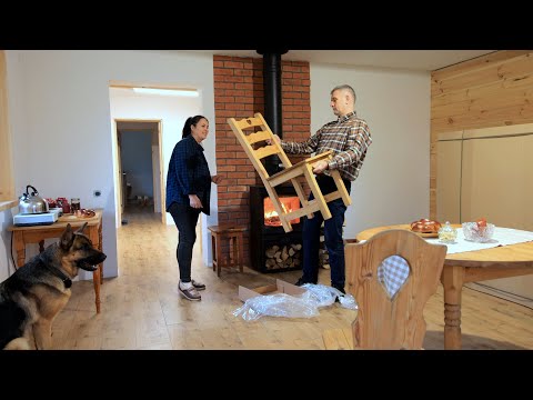 Family life in the village. Unpacking furniture and setting up the household