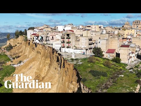 Houses and cars teeter on cliff edge after Sicilian landslide