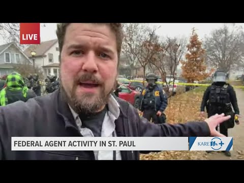 Standoff outside St. Paul raid as officers hold line and protesters gather
