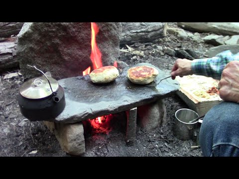 Primitive Cooking Stuffed Bannock On A Stone
