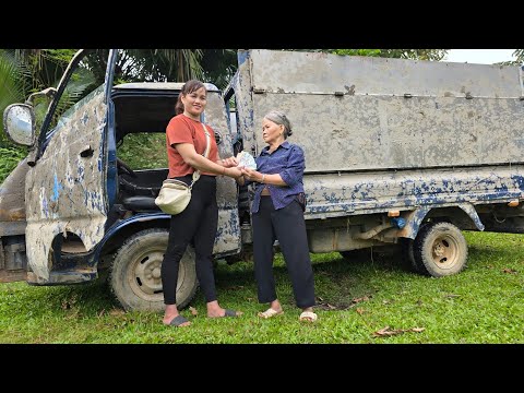 Girl repairs and restores old scrap trucks.
