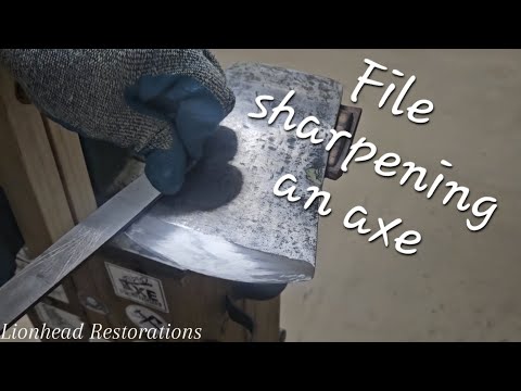 File sharpening an axe.