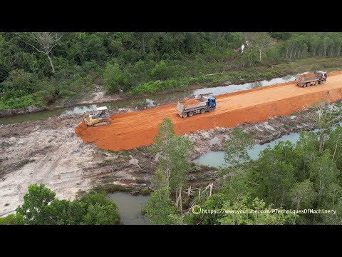 Wonderful Showing Dozer Pushing Soil And Dump Trucks Unloading Soil Building New Road Construction