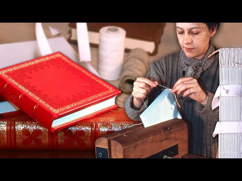 Handmade book and its artistic binding. Sewn and glued from paper and to a cover