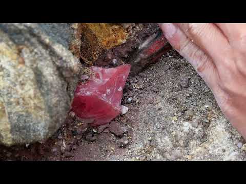Red crystals are formed in volcanic caves by the sea. Gems, diamonds
