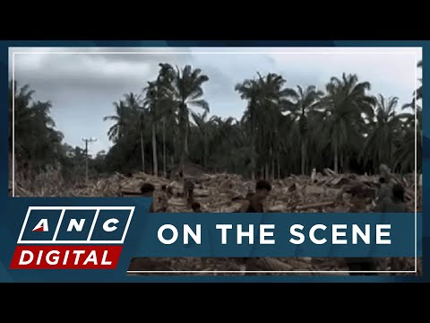 LOOK: Indonesians climb over logs in walk to aid center as flood deaths top 900 | ANC