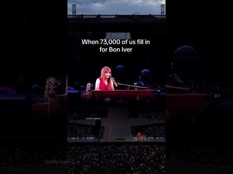 Taylor Swift smiling proudly when 73,000 fans sang Bon Iver's part in Exile at eras tour