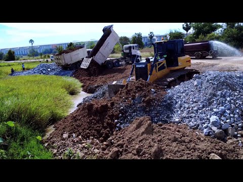 Professional Landfill Operation SHANTUI DH17C3 Dozer Pushing Stone to Fill Lowland with Dump Truck