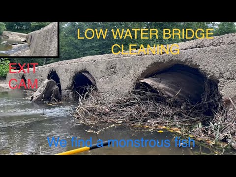 unclogging low water bridge with tons of debris/rusted out culverts 06/2023
