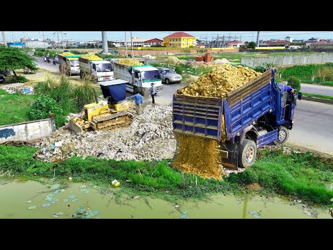 Perfectly Start New Project!Use Dump Truck Filling Land RockTrash, Bulldozer Pushing Into WaterPond