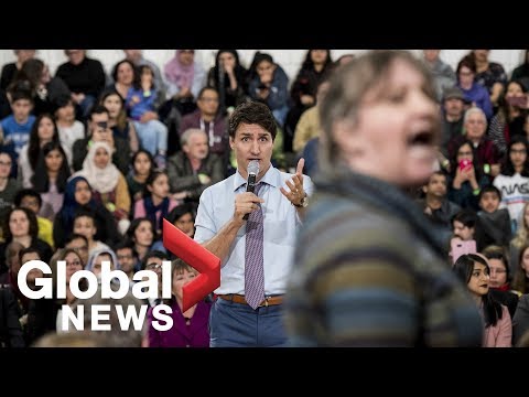 Trudeau gets heated as hecklers interrupt his talk on climate change