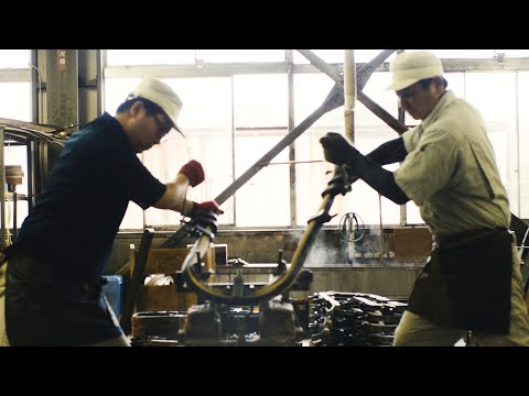 Bending hard wood. The process of making chairs at a workshop specializing in bent wood.
