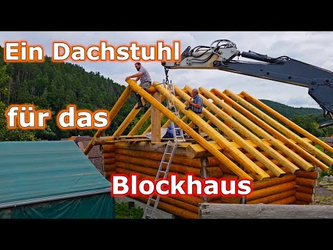 The log cabin is getting a roof.