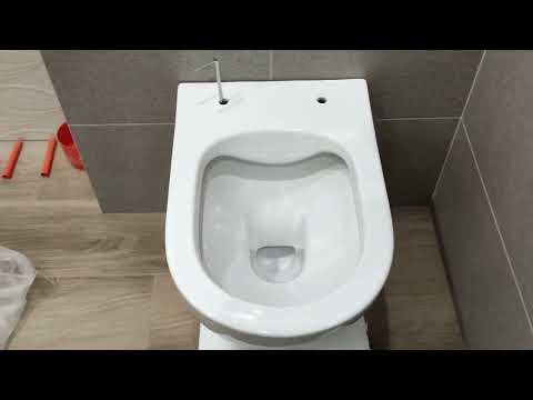 Installing a Grohe flush button and a Rostriks CHROME wall-hung toilet with concealed fastening