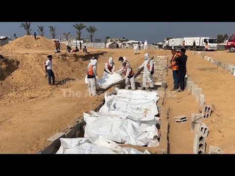 Health workers in Gaza bury bodies of Palestinians returned by Israel