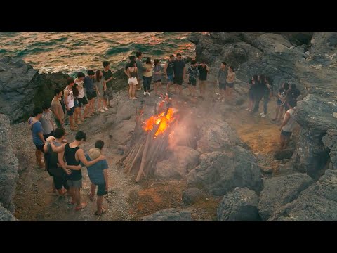A tsunami traps a group of students on a remote island with no contact to the outside world