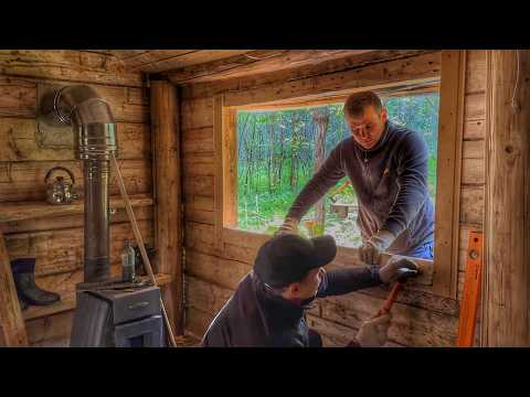 Log cabin has become much more comfortable after installing a large window.