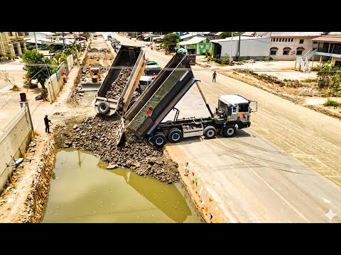 Road foundation laying process road construction, Trago 25.5T dump truck and Komatsu Bulldozer