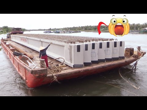 Tugboats Struggle to Haul the Barge Through the Narrow Canal Gate