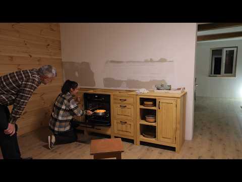 Country life in a remote village. Unpacking furniture. Apple pie by the fireplace