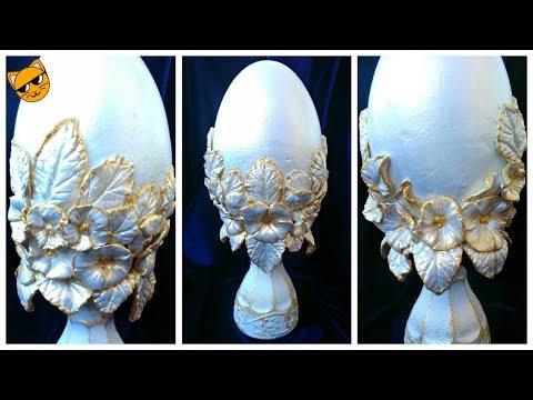 Gypsum egg decorated with paper clay flowers.