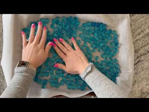 Pour Dollar Store gems into a baking pan to make jaw dropping garden decor!