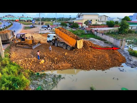 Development City, Processing Filling Up The Land huge, Bulldozer KOMATSU D60P, Dump Truck unloading