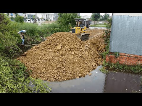 Wonderful Landfill Project! Komatsu D20P Dozer Pushing Stones Delete Deep Pond with Dump Truck