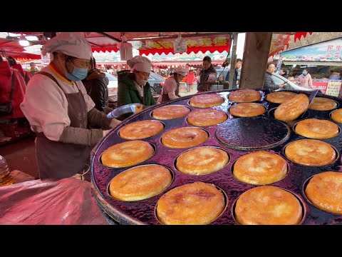 Changchun Market in Jilin, China. The bustling crowds are surging like a tide in the food market