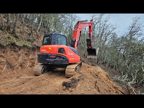 Steep granite hillside road build day 1 with the Kubota KX 080 4 excavator