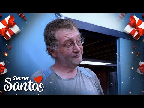 Skeptical wrestling coach gets surprise of a lifetime from Secret Santa in front of the entire team