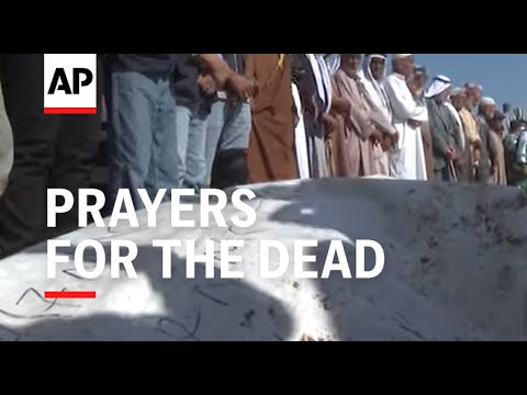 Prayers for the dead as bodies of 54 Palestinians buried in Gaza after return by Israel