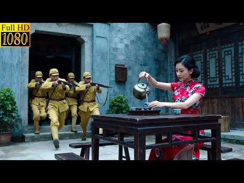 The woman making tea is a hidden, top-tier agent who single-handedly wipes out 500 Japanese soldiers