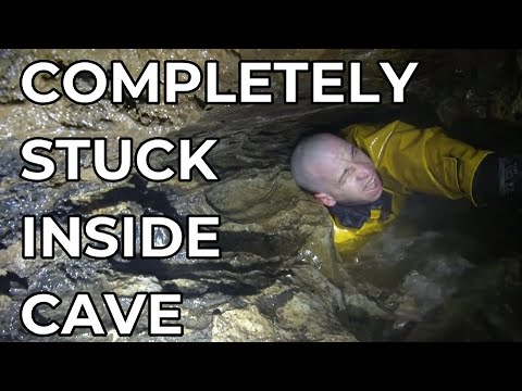 DIVERS REACT TO MAN STUCK DEEP INSIDE A CAVE