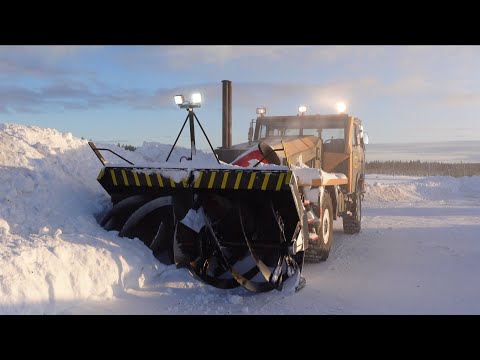 Snow clearing with old military snowblower