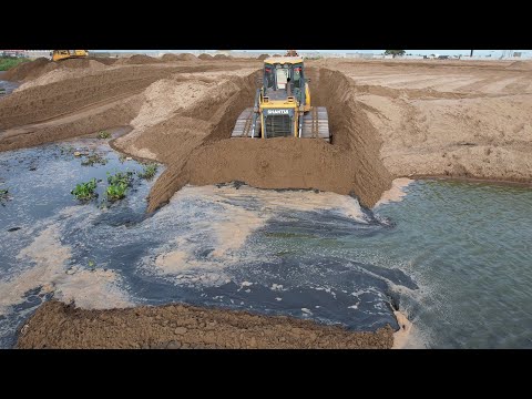 Wonderful SHANTUI Bulldozer Pushing sand fill in mud with 22ton Dump truck pouring 