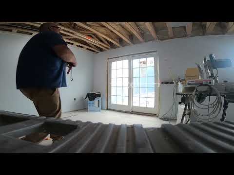 Putting glass door in the basement by himself! No help just him 😆😁Working hard 