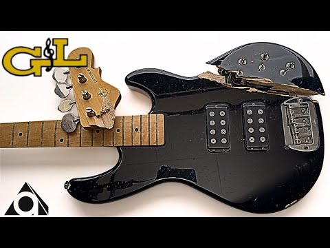 Restored electric bass with broken neck and body.
