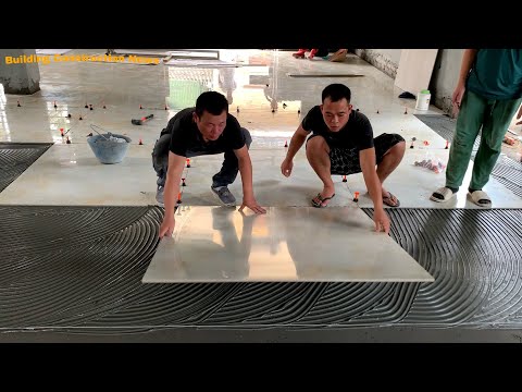 Tools And Skills For Construction Of Living Room Floors With Beautiful Imitation Stone Ceramic Tiles