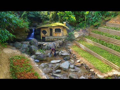 I built a survival house by the waterfall — with a pool, garden and warm stove. Off-grid life
