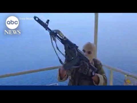 Iranian state TV airs video of masked gunmen boarding ship near Strait of Hormuz