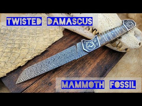 I made a twisted damascus knife with mammoth fossil